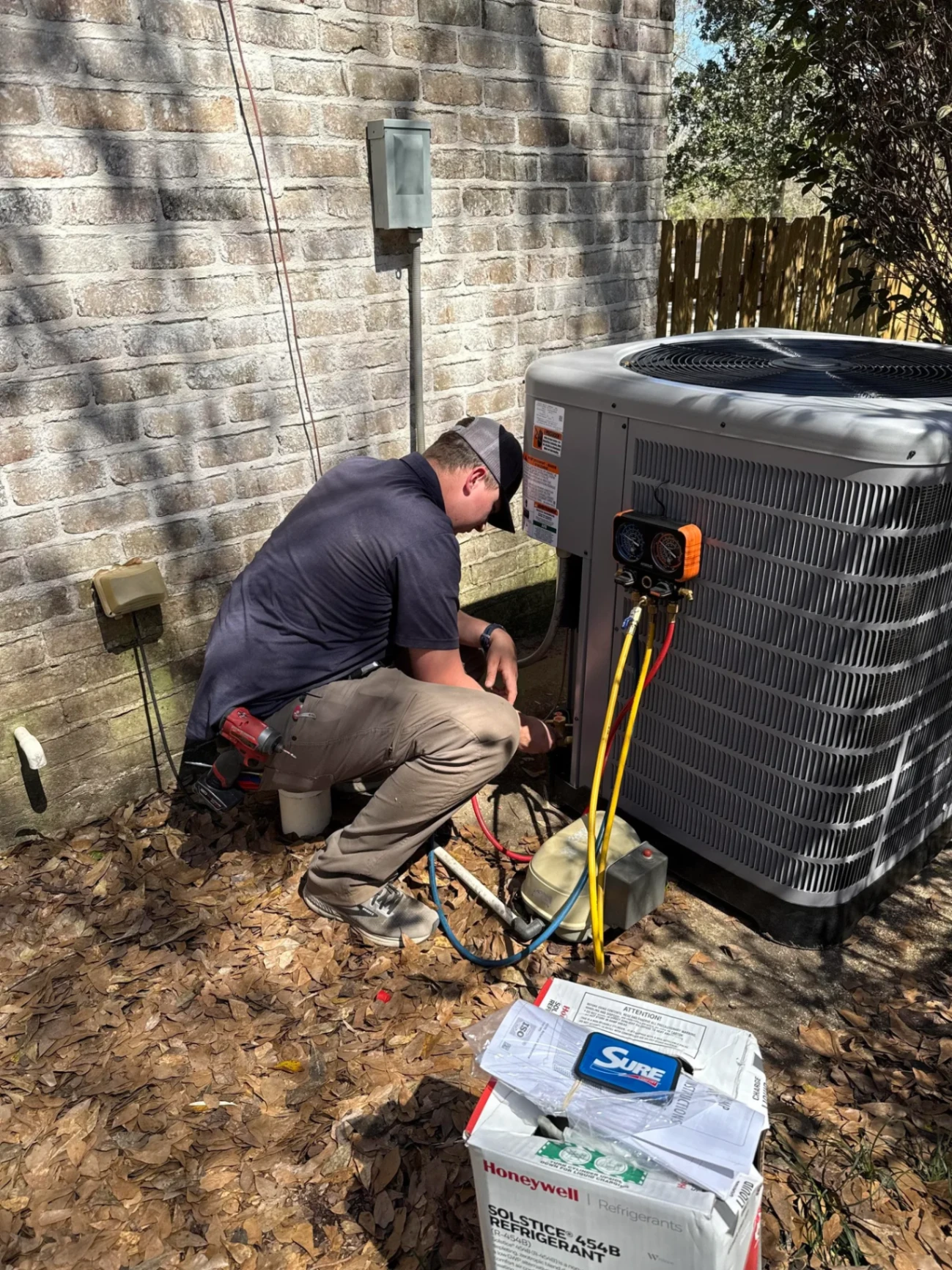 Technician servicing a heat pump in Hammond, LA